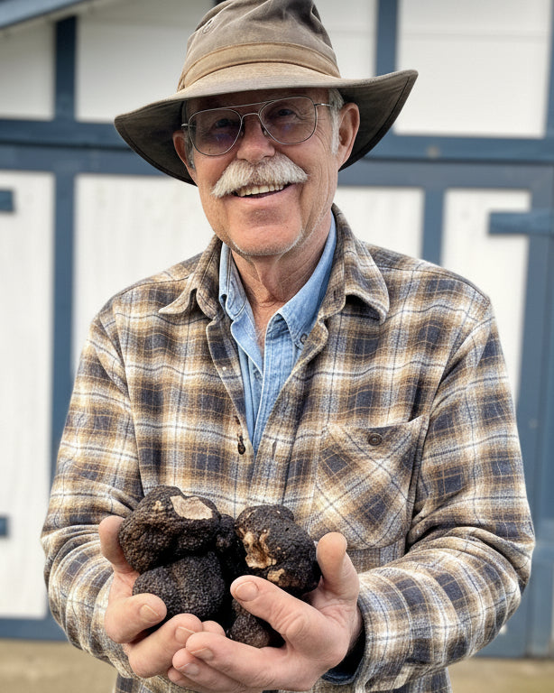 Man holding truffles in both hands