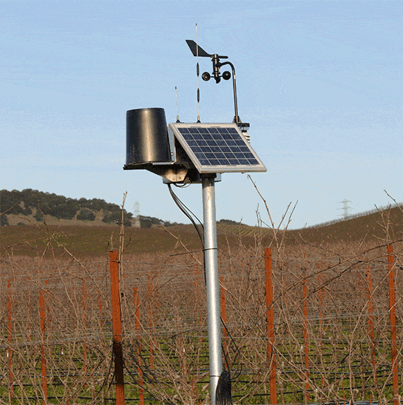 Small solar panel and other instruments on a field.